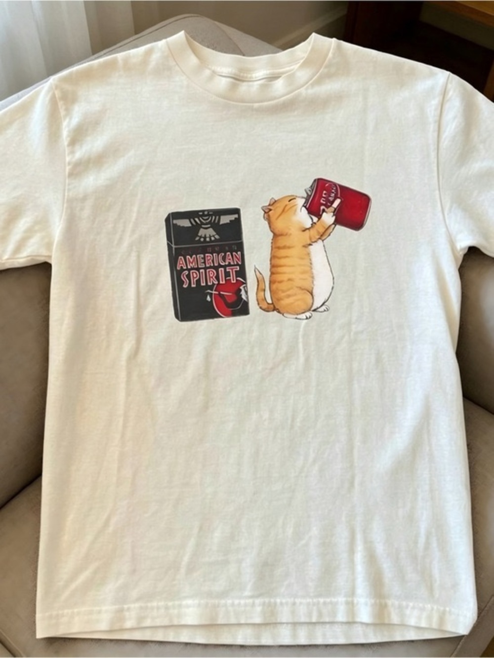 White Short-Sleeve Tee with Orange Cat and Red Graphic